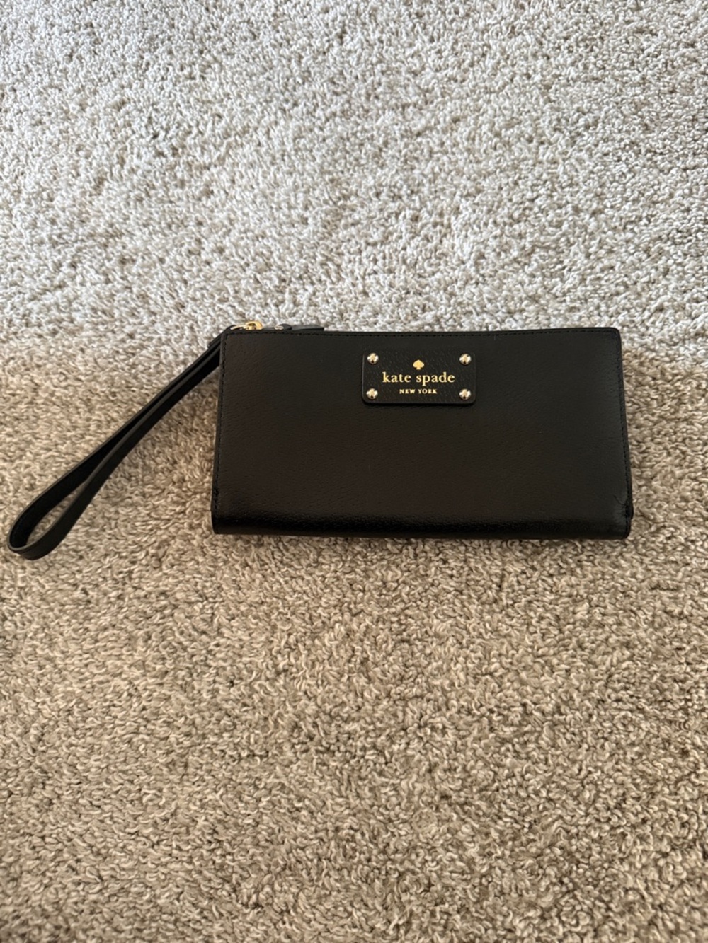 kate spade black exterior tan interior zip-around wristlet